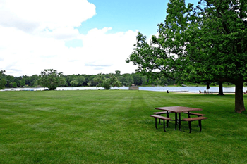 picnic area with lake views at the plaza at lamberton